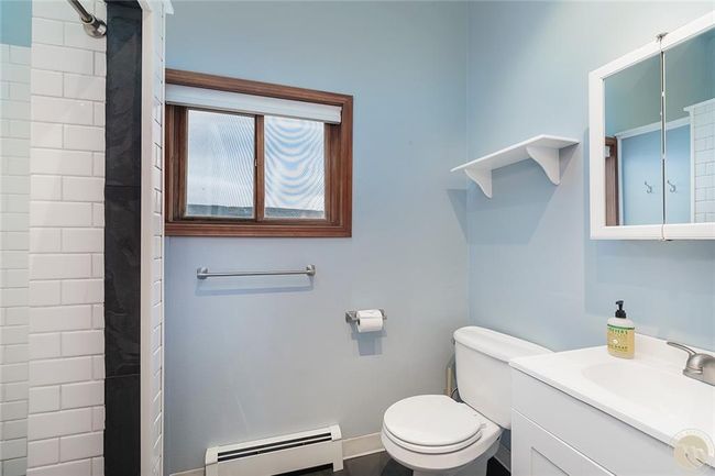 Master bathroom. All main floor rooms with hot water heat registers. | Image 13