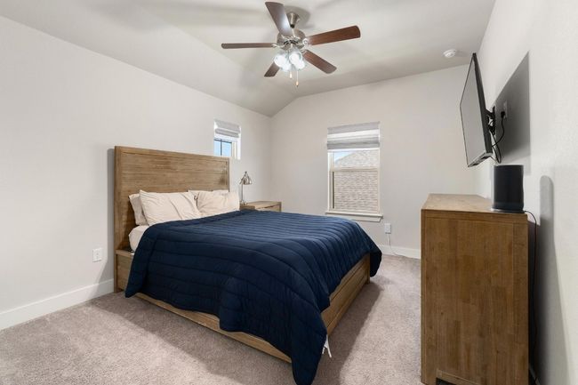 Upstairs carpeted bedroom with lofted ceiling a walk in closet and vaulted ceiling. | Image 28