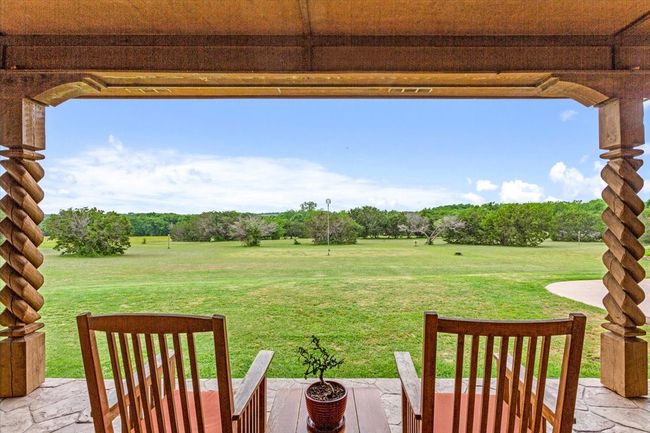 View of green lawn with a patio | Image 30