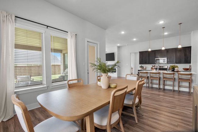 Dining area featuring dark wood-style floors and recessed lighting | Image 18