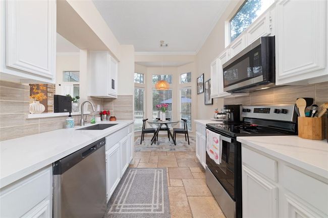 36 N Rain Forest Ct, House other with 4 bedrooms, 2 bathrooms and 2 parking in Spring TX | Image 12