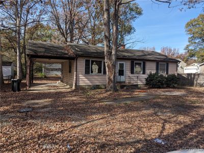 Ranch-style house with a carport | Image 1