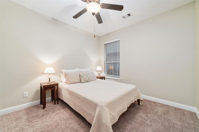 Just past the office are two secondary bedrooms and a full bathroom. This is the first of 2 bedrooms towards the front of the home. | Image 9