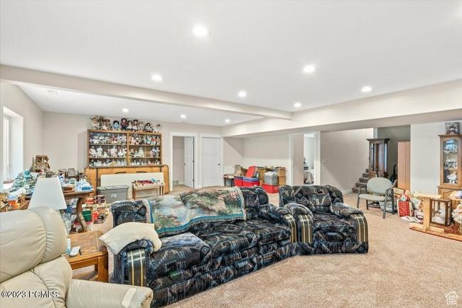 Living area with recessed lighting, carpet, and stairs | Image 9