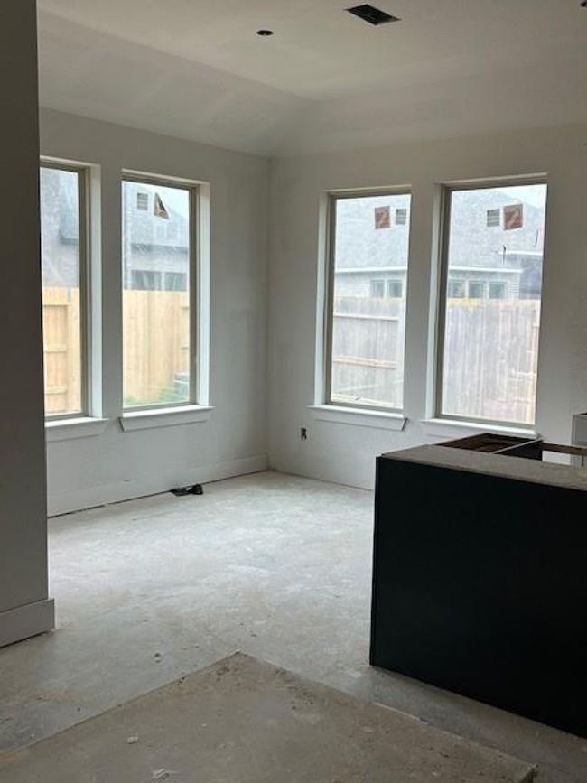 Breakfast area provides windows throughout for a relaxing area. | Image 6