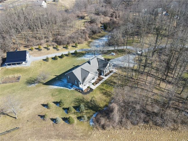 Welcome to 8592 County Rd 14! The front view of this beautiful, 3 bed/3 bath, open concept ranch home with a DOUBLE DOOR walk out basement on 67 acres! | Image 6