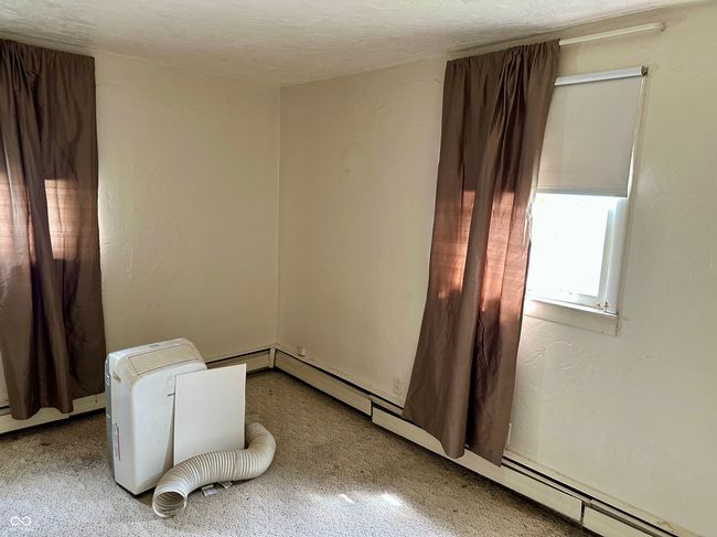 unfurnished room with a textured ceiling and carpet | Image 11