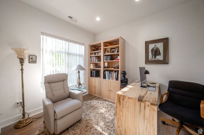 Home office featuring wood finished floors, baseboards, and recessed lighting | Image 11
