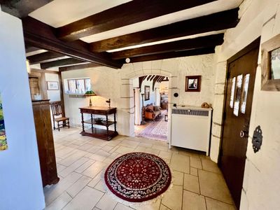 Interior space featuring beam ceiling and light tile flooring | Image 3