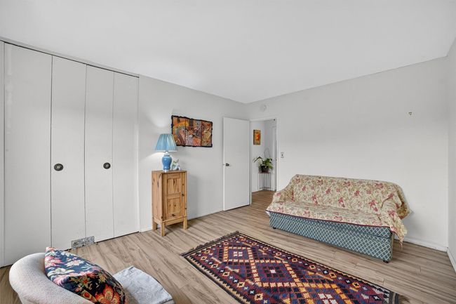 Living area with wood finished floors and baseboards | Image 32