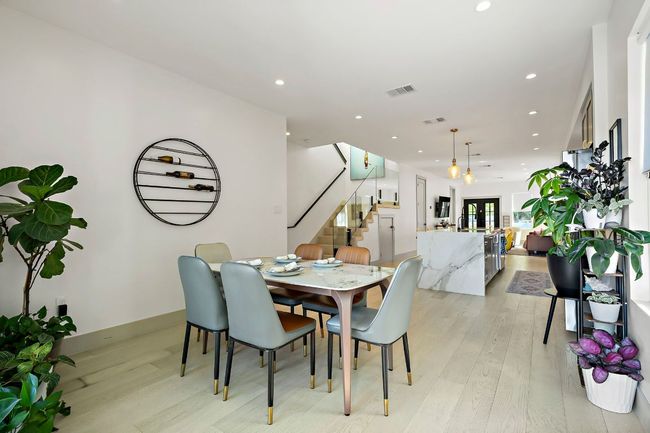 Dining room with stairway, recessed lighting, visible vents, and light wood-style flooring | Image 13