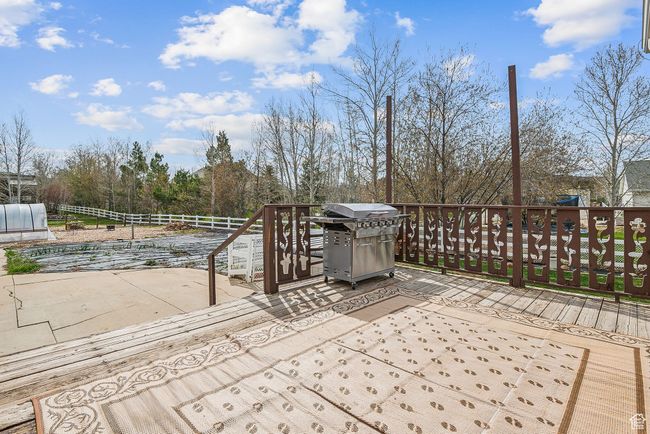 Exterior space featuring grilling area, fence, and a deck | Image 55