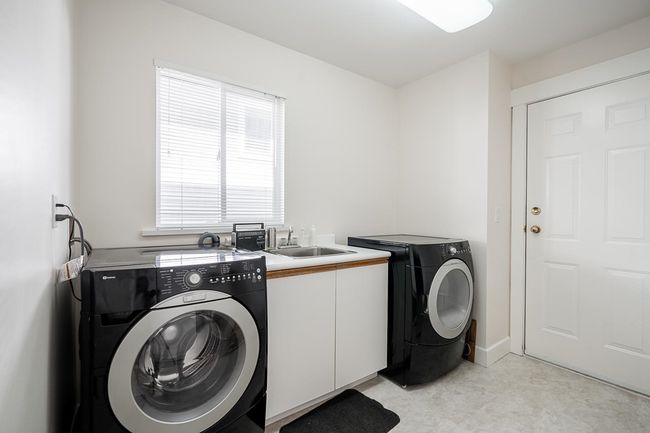 Washroom with cabinet space and separate washer and dryer | Image 17