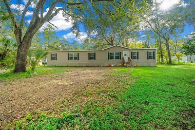 9649 Ne 91st Terrace, House other with 4 bedrooms, 2 bathrooms and null parking in Fort Mc Coy FL | Image 1