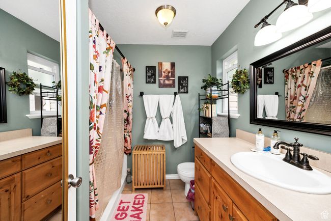 Main bedroom ensuite bathroom with visible vents, vanity, and a healthy amount of light | Image 23