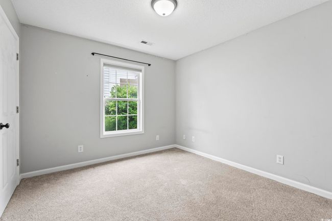 Carpeted empty room with baseboards | Image 14