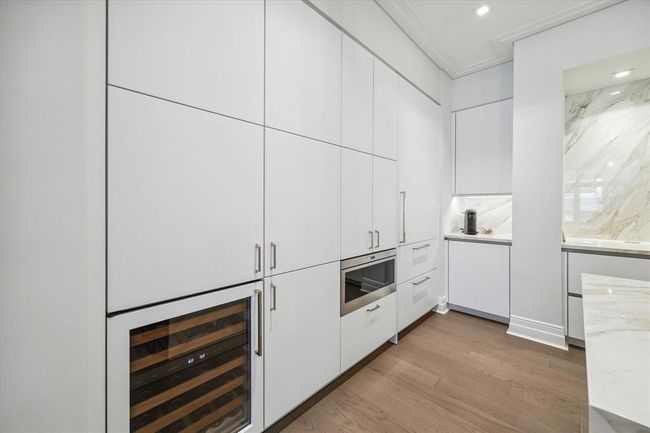 [Kitchen] SieMatic custom designed kitchen.. like a wall of art, seamlessly integrating the Sub Zero refrigerator, pantry, beverage refrigerator and Wolf microwave while offering ample storage space Functional and beautiful! | Image 14