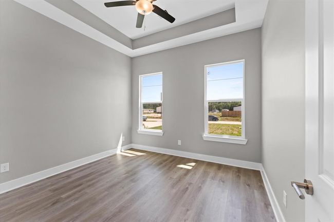 Second bedroom with modern finishes and no carpet. | Image 22