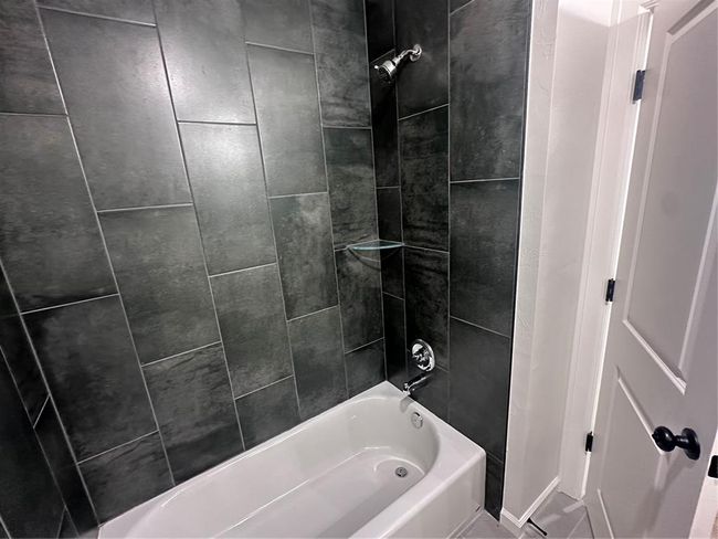 Bathroom featuring washtub / shower combination | Image 13