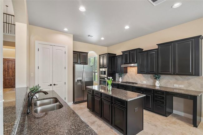 This charismatic kitchen has extensive workspace, and amazing storage space for every need. | Image 10