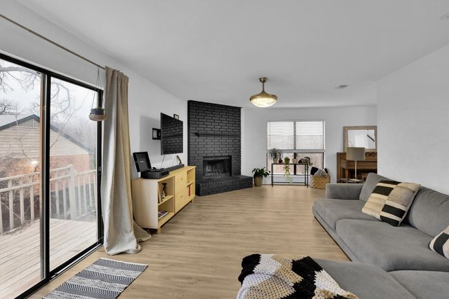 Living room featuring a fireplace and light wood finished floors | Image 7