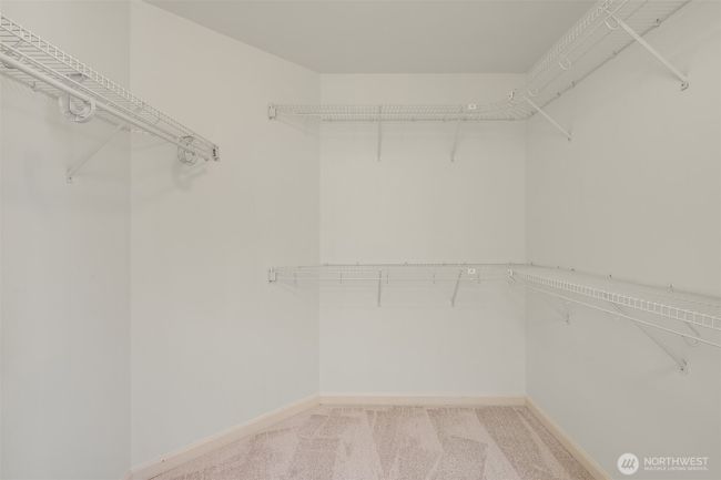 Walk in closet in primary bedroom | Image 23