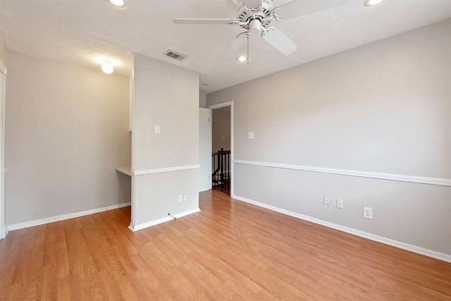 The largest of the three upstairs rooms is at the back and overlooks the yard. | Image 32