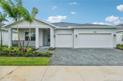 6398 Nw Sweetwood Drive, House other with 3 bedrooms, 2 bathrooms and 3 parking in Port Saint Lucie FL | Image 1