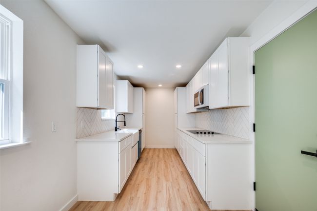 Unfurnished living room featuring a ceiling fan, recessed lighting, and light wood-style floors | Image 4
