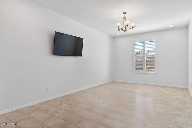 Den featuring recessed lighting, baseboards, and an inviting chandelier. Table/personal items removed virtually for picture. | Image 36