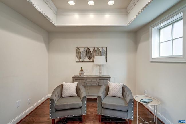 This cozy nook makes a great home office or wine cellar. | Image 23