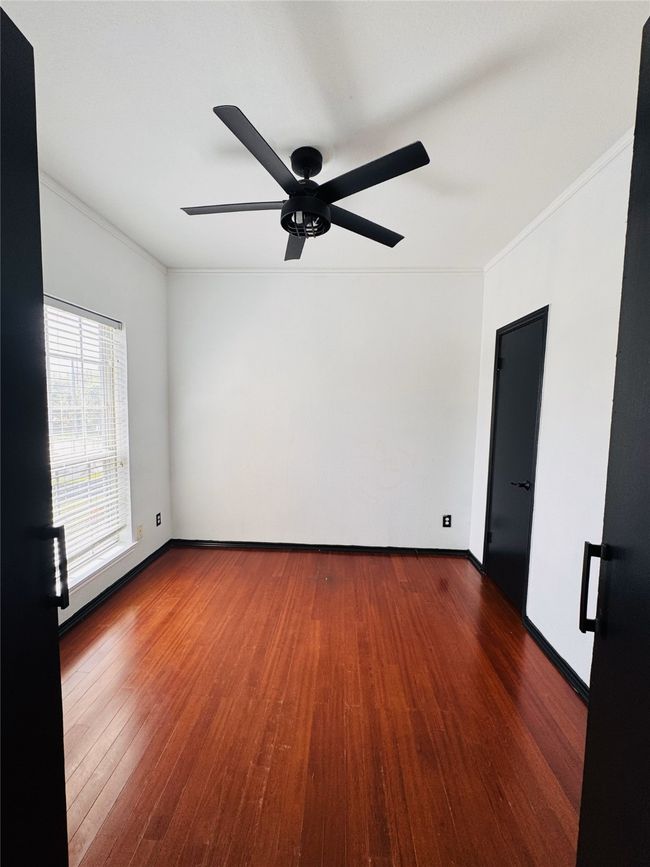 Bedroom 2 with wood-type flooring, baseboards, ornamental molding, and ceiling fan | Image 6