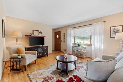 Large front window floods the living room with natural light. | Image 2