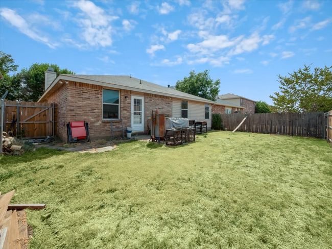 Back of property with a lawn | Image 25