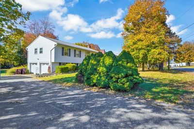 View of home's exterior featuring a garage | Image 2