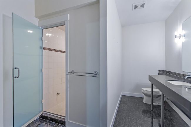 Full bath featuring visible vents, a shower stall, vanity, baseboards, and toilet | Image 27