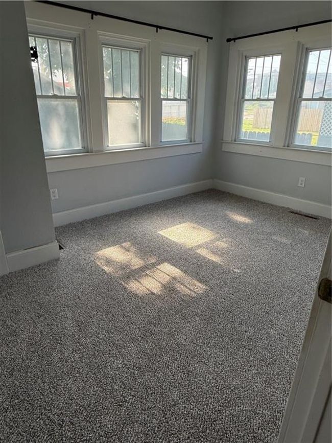 Carpeted spare room featuring baseboards | Image 14