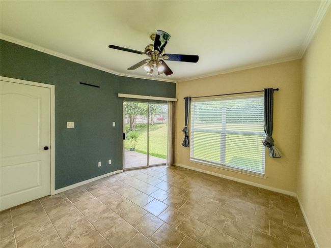 Spare room with ornamental molding and ceiling fan | Image 23