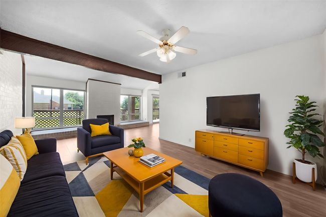 Virtually staged. Enormous L shaped living area could be dual purpose living and work space. Room for a pool table! | Image 5