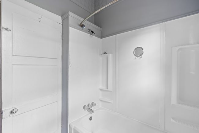 Bathroom featuring shower / bathtub combination | Image 31