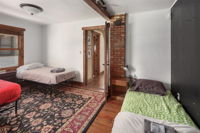Bedroom with wood finished floors | Image 23