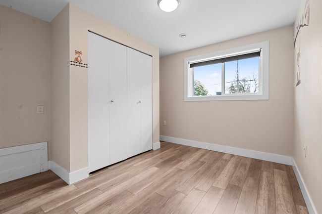 Unfurnished bedroom featuring light wood-type flooring, a closet, and baseboards | Image 18