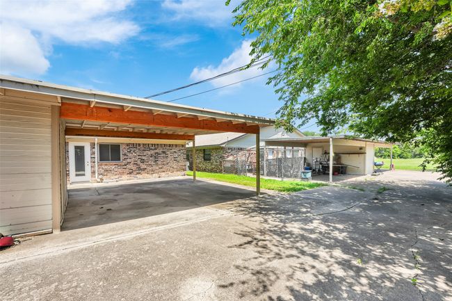 View of car parking with a carport and concrete driveway | Image 19