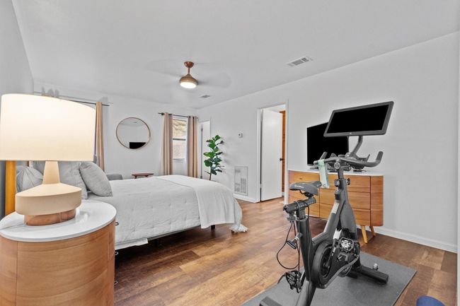 Bedroom with ceiling fan and dark hardwood / wood-style floors | Image 16
