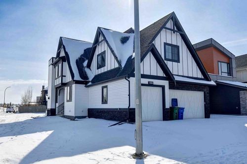 1209 Coopers Drive Sw, Home with 4 bedrooms, 2 bathrooms and 3 parking in Airdrie AB | Card Image