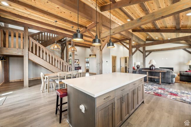 Kitchen island with dining and family room visible. | Image 29