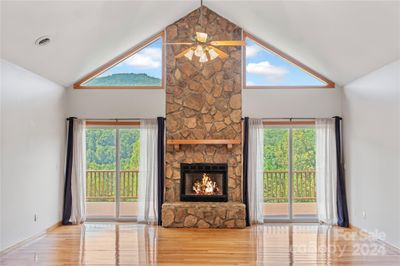 Stone fireplace with gas logs | Image 1