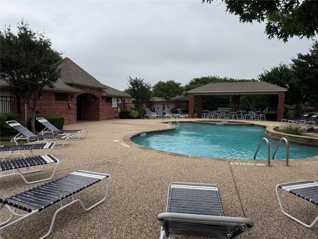 Pool with a gazebo, fence, and a patio | Image 22