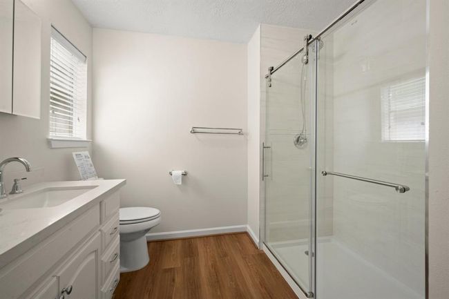 The upgraded primary bath includes a sleek frameless glass shower, new fixtures | Image 23