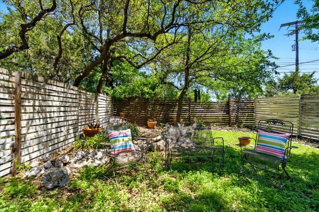 View of yard with a fenced backyard | Image 6